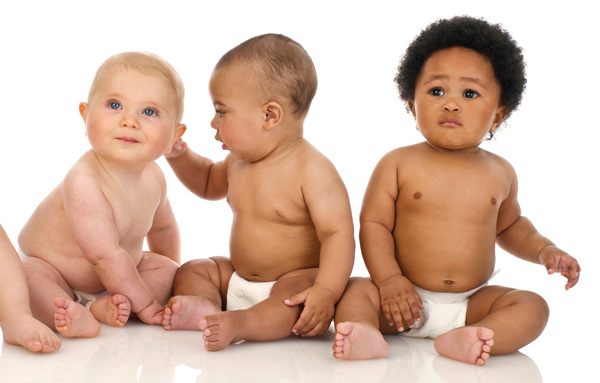 Three babies from different backgrounds, in nappies